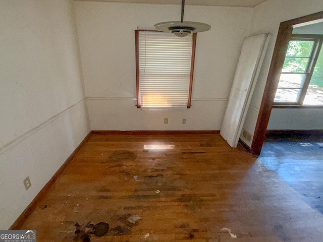 668 Lynn Cir SW, Atlanta, GA 30311 - unfurnished dining area featuring wood finished floors and baseboards