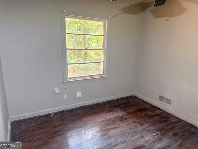 668 Lynn Cir SW, Atlanta, GA 30311 - unfurnished room with a wealth of natural light, visible vents, baseboards, and dark wood-style floors