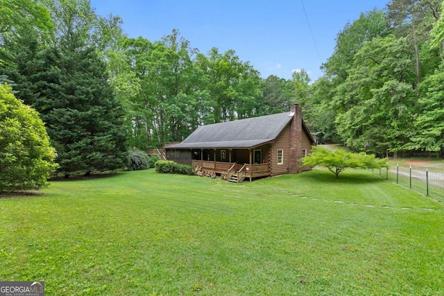 view of yard featuring a wooden deck