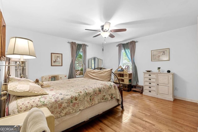 16335 Henderson Rd, Milton, GA 30004 - bedroom with wood finished floors and ceiling fan