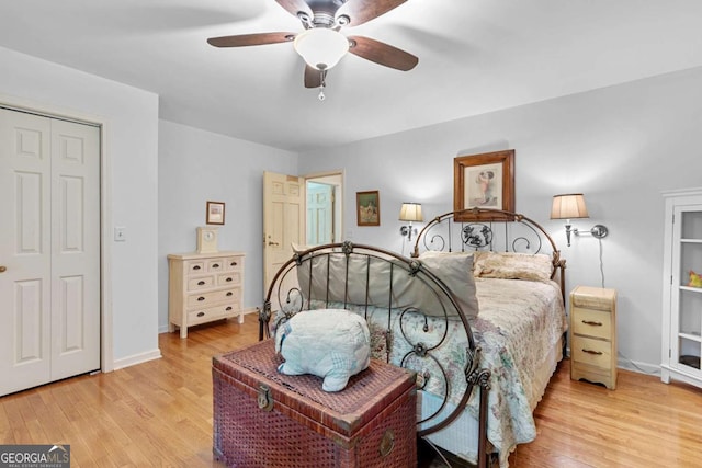16335 Henderson Rd, Milton, GA 30004 - bedroom featuring wood finished floors, a ceiling fan, and baseboards