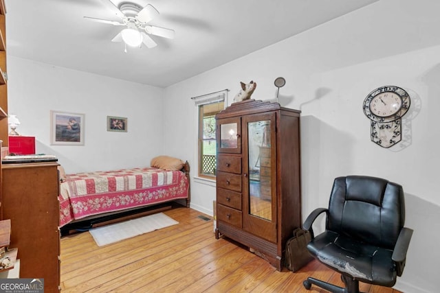 16335 Henderson Rd, Milton, GA 30004 - bedroom with light wood finished floors, ceiling fan, and baseboards