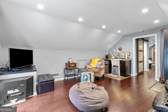 16335 Henderson Rd, Milton, GA 30004 - living area with lofted ceiling, wood finished floors, recessed lighting, and baseboards