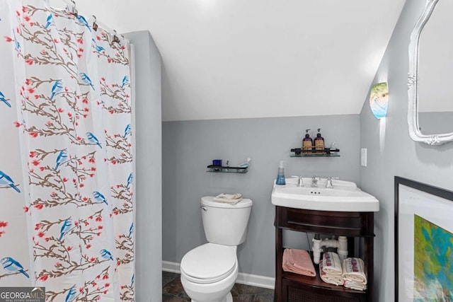 16335 Henderson Rd, Milton, GA 30004 - full bath with lofted ceiling, toilet, a shower with curtain, baseboards, and vanity