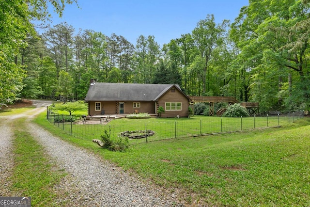 16335 Henderson Rd, Milton, GA 30004 - rustic home featuring a chimney, driveway, a forest view, and a patio area