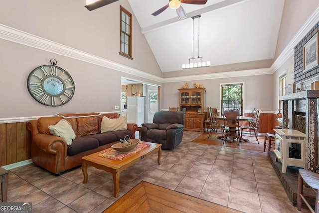16335 Henderson Rd, Milton, GA 30004 - living area with high vaulted ceiling, ceiling fan, tile patterned flooring, beamed ceiling, and wainscoting