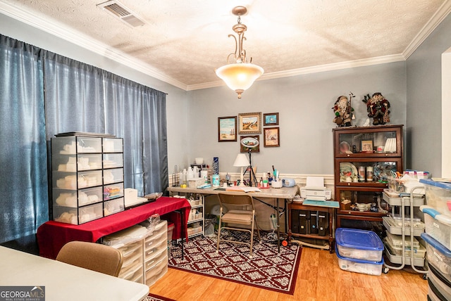 1071 Wildflower Way, Madison, GA 30650 - office with wood finished floors, a textured ceiling, and crown molding