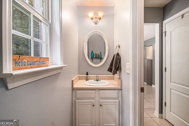 1071 Wildflower Way, Madison, GA 30650 - bathroom featuring tile patterned flooring, vanity, and baseboards