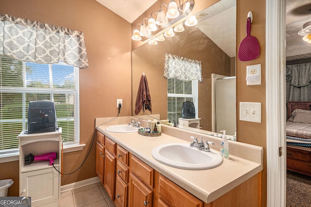 1071 Wildflower Way, Madison, GA 30650 - bathroom featuring lofted ceiling, double vanity, tile patterned floors, and a shower with shower door