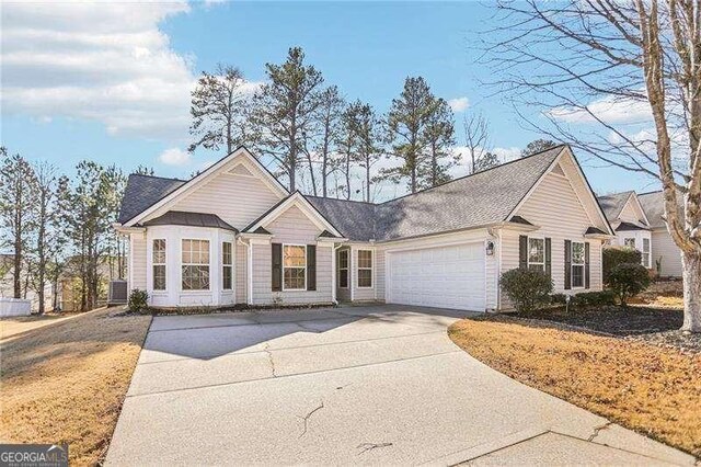 334 Hunterian Pl, Newnan, GA 30265 - ranch-style house featuring driveway, cooling unit, and a garage