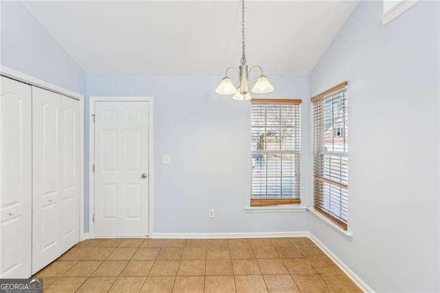 334 Hunterian Pl, Newnan, GA 30265 - unfurnished dining area featuring a chandelier, lofted ceiling, and a wealth of natural light