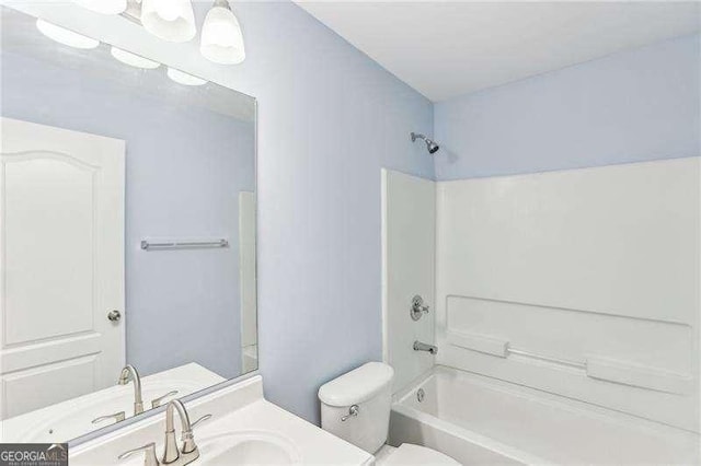 334 Hunterian Pl, Newnan, GA 30265 - bathroom featuring toilet, vanity, and washtub / shower combination