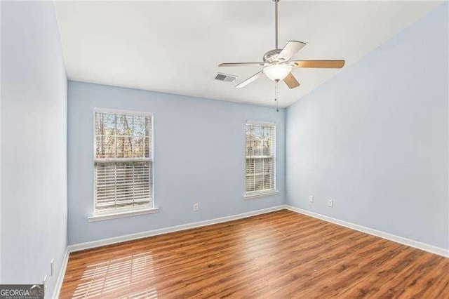 334 Hunterian Pl, Newnan, GA 30265 - empty room with wood finished floors, visible vents, baseboards, and a ceiling fan