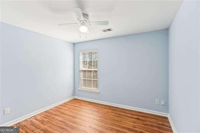 334 Hunterian Pl, Newnan, GA 30265 - unfurnished room featuring ceiling fan, baseboards, visible vents, and wood finished floors