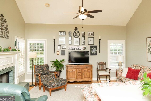 17 Hampton Way, Carrollton, GA 30116 - living area with a fireplace, lofted ceiling, baseboards, and a ceiling fan
