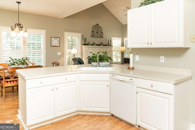 17 Hampton Way, Carrollton, GA 30116 - kitchen featuring a peninsula, light wood-style flooring, a sink, light countertops, and white dishwasher