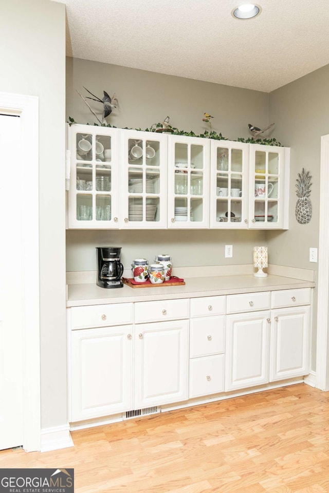 17 Hampton Way, Carrollton, GA 30116 - bar with light wood-type flooring, visible vents, and recessed lighting