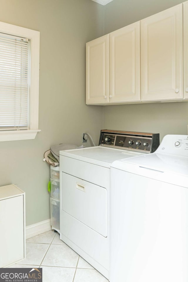 17 Hampton Way, Carrollton, GA 30116 - laundry room featuring independent washer and dryer, cabinet space, and light tile patterned floors