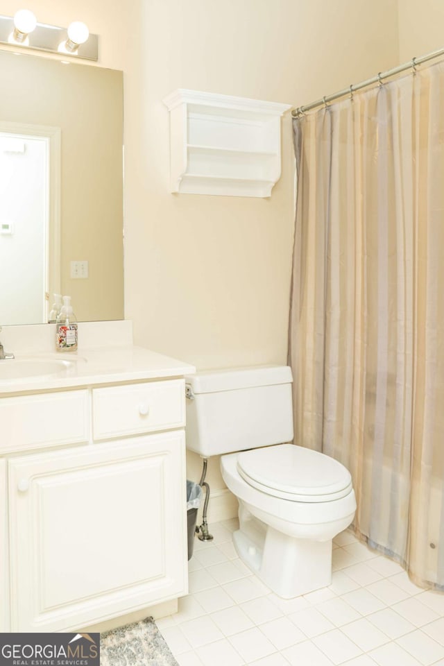 17 Hampton Way, Carrollton, GA 30116 - full bath with vanity, toilet, a shower with shower curtain, and tile patterned flooring