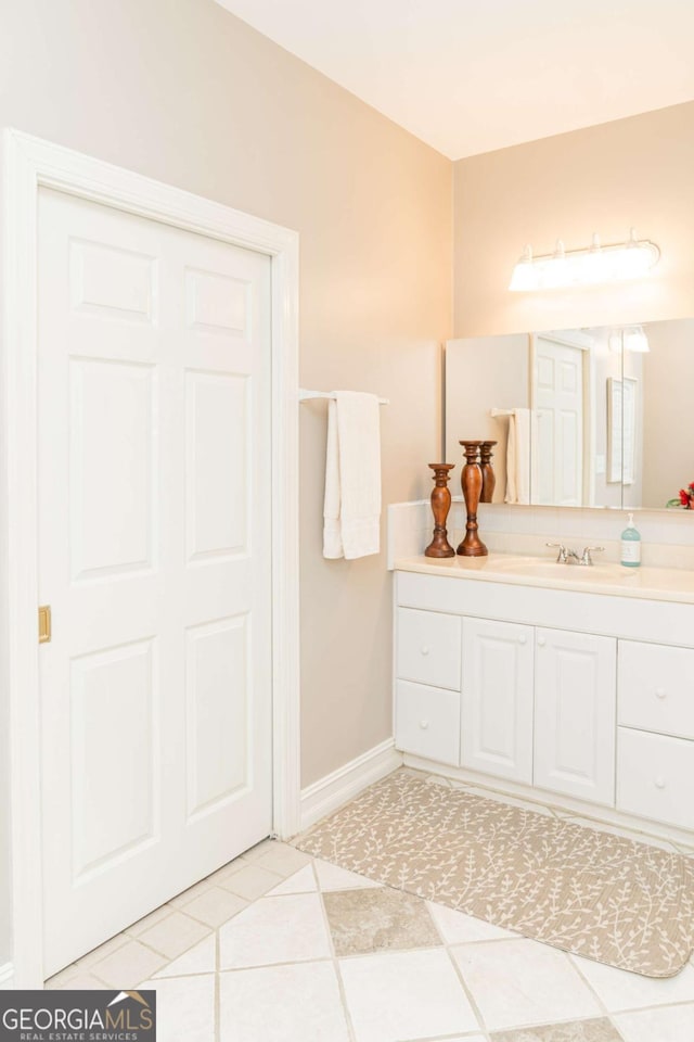 17 Hampton Way, Carrollton, GA 30116 - bathroom featuring baseboards, tile patterned flooring, and vanity