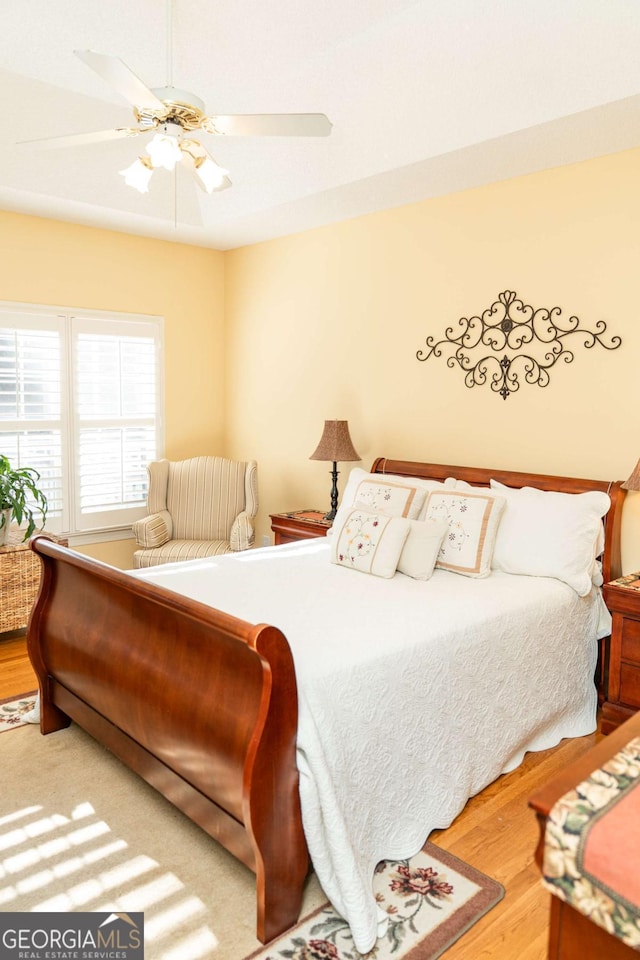 17 Hampton Way, Carrollton, GA 30116 - bedroom with a ceiling fan and wood finished floors