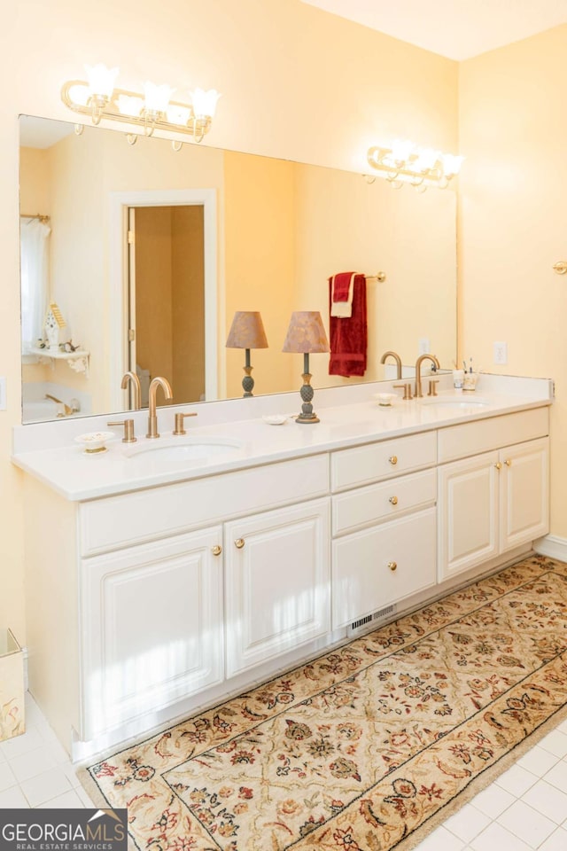 17 Hampton Way, Carrollton, GA 30116 - bathroom featuring double vanity and tile patterned flooring