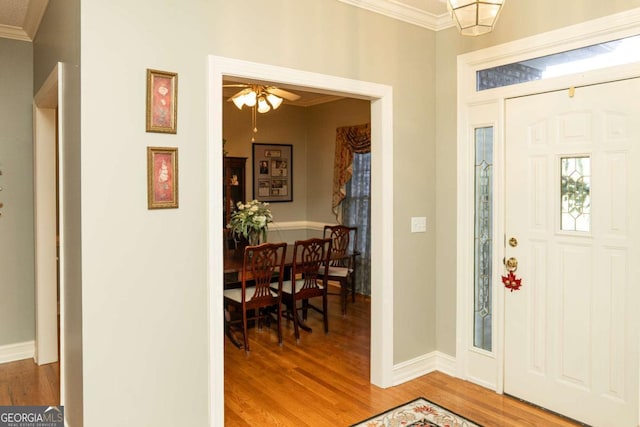 17 Hampton Way, Carrollton, GA 30116 - foyer entrance with ornamental molding, light wood-style flooring, and ceiling fan