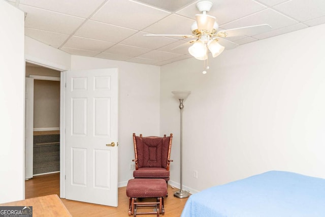 17 Hampton Way, Carrollton, GA 30116 - bedroom with a drop ceiling, light wood-style flooring, and a ceiling fan