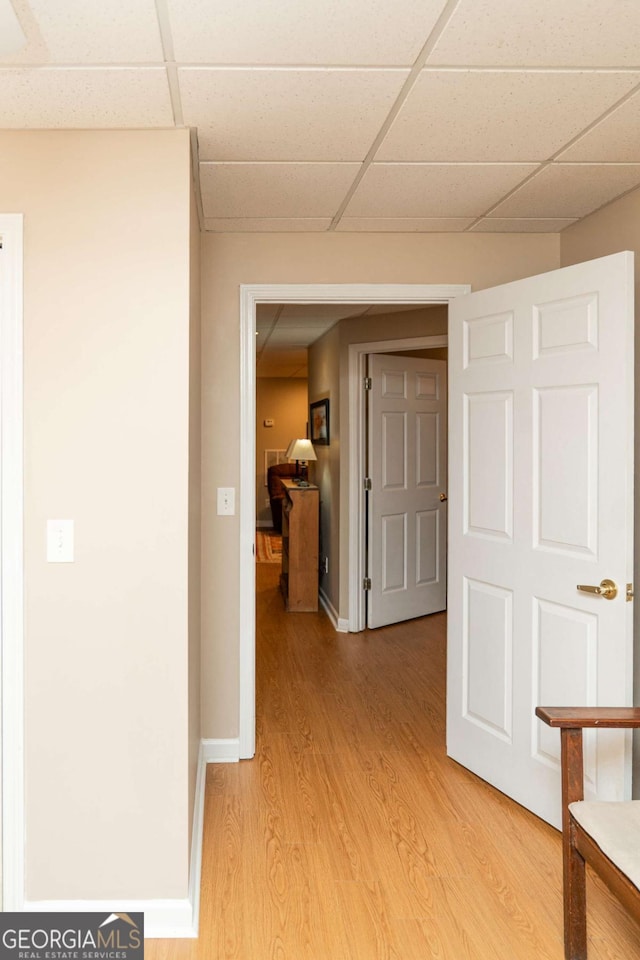 17 Hampton Way, Carrollton, GA 30116 - hall featuring a paneled ceiling, baseboards, and light wood-type flooring