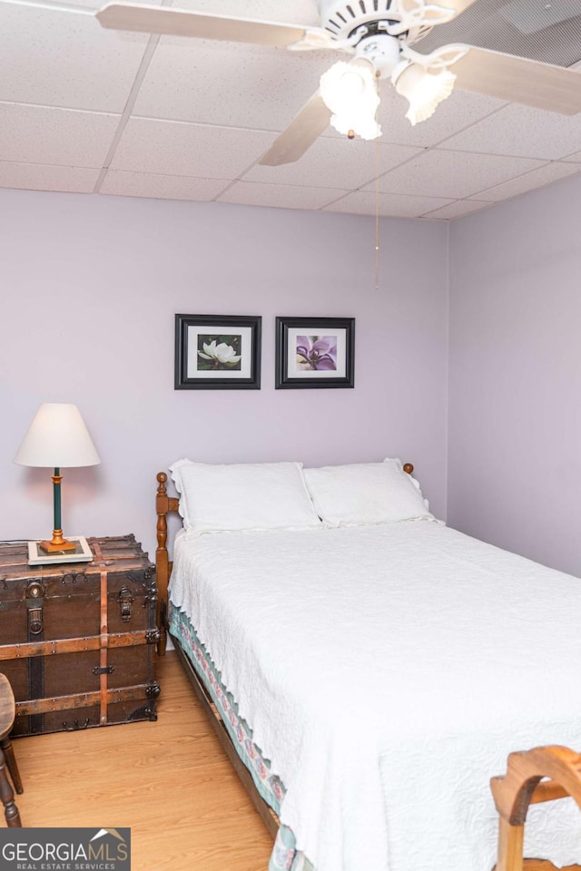 17 Hampton Way, Carrollton, GA 30116 - bedroom featuring a drop ceiling, wood finished floors, and a ceiling fan