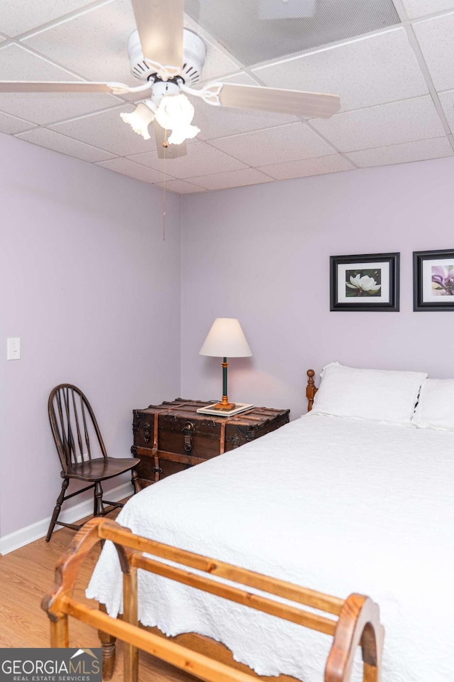 17 Hampton Way, Carrollton, GA 30116 - bedroom featuring a paneled ceiling, baseboards, a ceiling fan, and wood finished floors