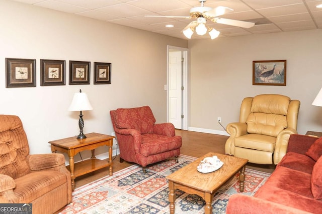 17 Hampton Way, Carrollton, GA 30116 - living room featuring a drop ceiling, a ceiling fan, and wood finished floors
