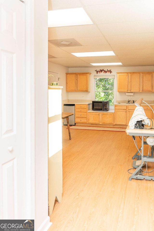 17 Hampton Way, Carrollton, GA 30116 - kitchen featuring light brown cabinetry, dishwasher, black microwave, light wood-style floors, and light countertops