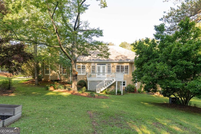 17 Hampton Way, Carrollton, GA 30116 - back of house featuring a yard, a deck, and stairs