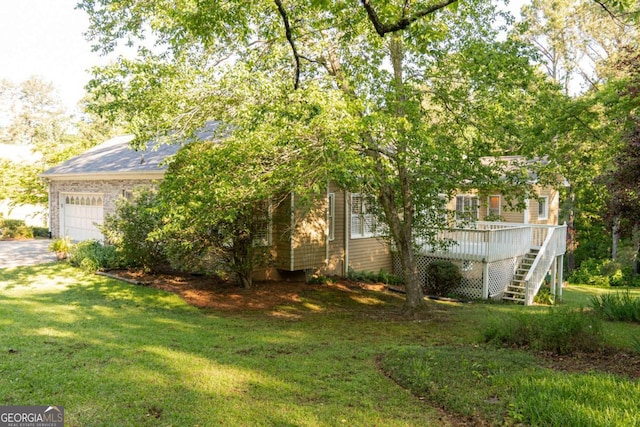 17 Hampton Way, Carrollton, GA 30116 - view of front of home with an attached garage, a front yard, stairway, and a wooden deck