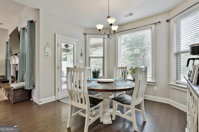 80 Kenwood Trl, Senoia, GA 30276 - dining area with visible vents, dark wood-style flooring, baseboards, and a notable chandelier