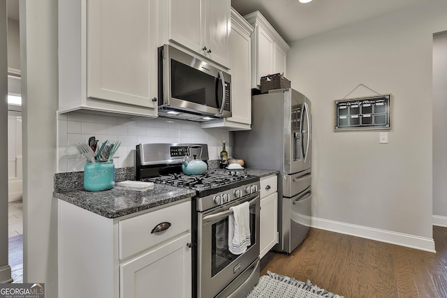 80 Kenwood Trl, Senoia, GA 30276 - kitchen with baseboards, dark wood-style flooring, stainless steel appliances, and tasteful backsplash