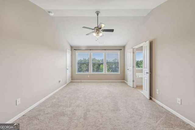 1257 Park Pass Way, Suwanee, GA 30024 - unfurnished bedroom featuring a ceiling fan, carpet floors, visible vents, baseboards, and lofted ceiling