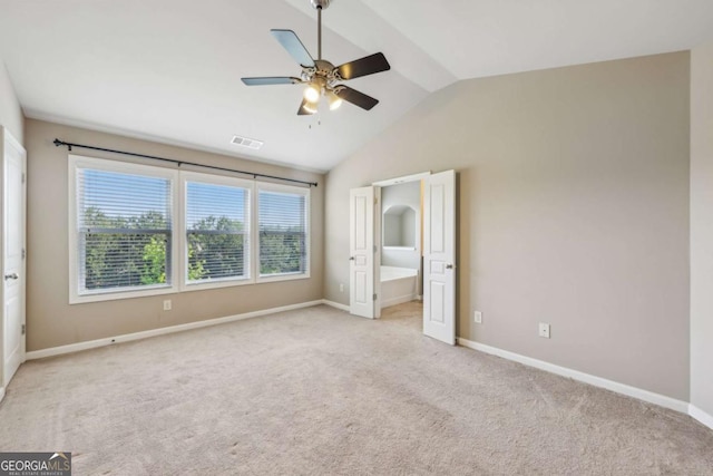 1257 Park Pass Way, Suwanee, GA 30024 - unfurnished bedroom featuring vaulted ceiling, light carpet, baseboards, and visible vents
