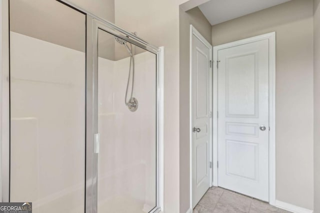 1257 Park Pass Way, Suwanee, GA 30024 - full bathroom with a shower stall, baseboards, and tile patterned flooring