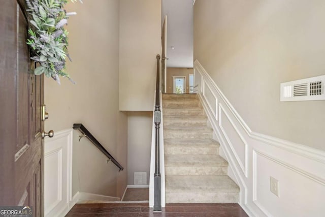 1257 Park Pass Way, Suwanee, GA 30024 - stairs featuring wainscoting, a decorative wall, and visible vents