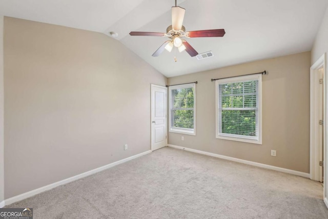 1257 Park Pass Way, Suwanee, GA 30024 - carpeted spare room featuring baseboards, ceiling fan, visible vents, and vaulted ceiling