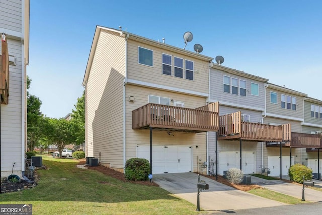 1257 Park Pass Way, Suwanee, GA 30024 - back of house with central AC unit, concrete driveway, an attached garage, and a lawn