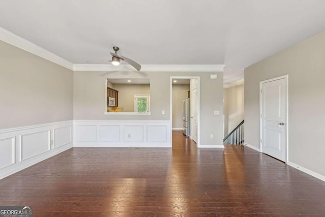 1257 Park Pass Way, Suwanee, GA 30024 - unfurnished living room featuring crown molding, dark wood-style flooring, and a ceiling fan