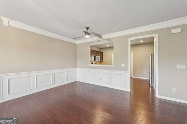 1257 Park Pass Way, Suwanee, GA 30024 - spare room featuring ornamental molding, ceiling fan, and dark wood-style floors