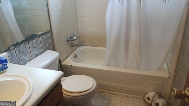 full bath featuring shower / bath combo with shower curtain, toilet, and vanity