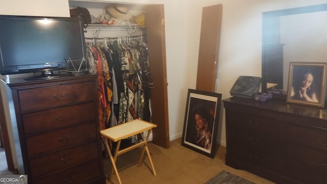 carpeted bedroom with a closet