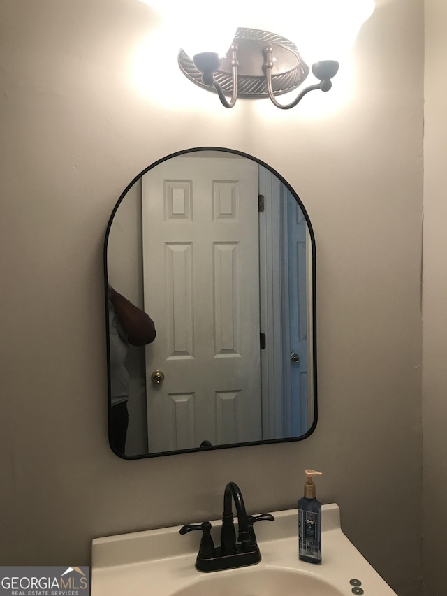 interior details featuring a sink