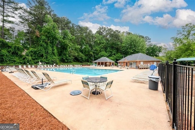 2759 Beddington Way, Suwanee, GA 30024 - community pool featuring a patio, view of scattered trees, a gazebo, and an outbuilding