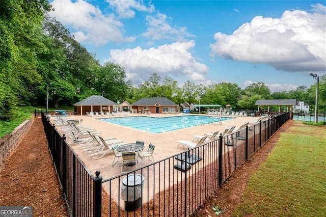 2759 Beddington Way, Suwanee, GA 30024 - community pool featuring a patio and view of scattered trees